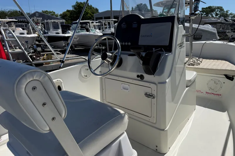 Slide: The Image of 2004 Hydra-Sports Lightning 170 CC boat interior with steering wheel and Garmin display. - 6