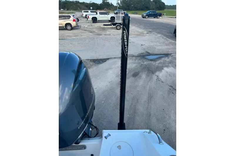 Slide: The Image of 2020 Sea Hunt Ultra 275SE boat with Power-Pole anchor in parking lot. - 56