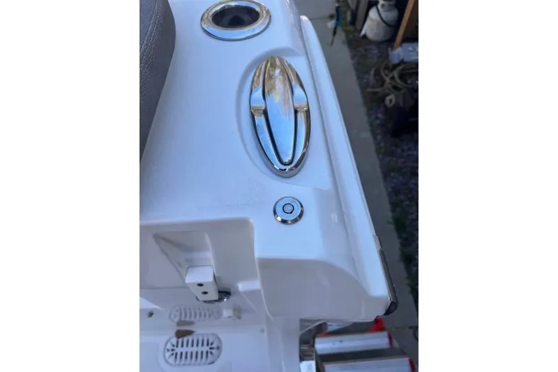 Slide: The Image of 2020 Sea Hunt Ultra 275SE boat detail with chrome fittings and white finish. - 52