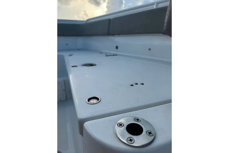 Slide: The Image of 2020 Sea Hunt Ultra 275SE boat deck with rod holders and seating. - 24