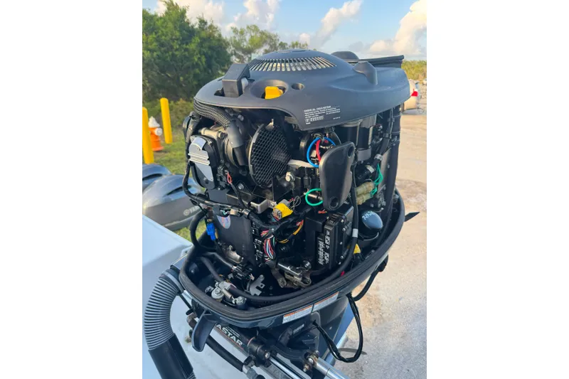 Slide: The Image of Open engine of a 2020 Sea Hunt Ultra 275SE boat, showcasing internal components. - 45