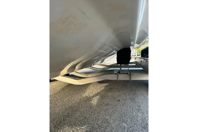 Slide: The Image of Underneath view of a 2020 Sea Hunt Ultra 275SE boat on a trailer. - 40