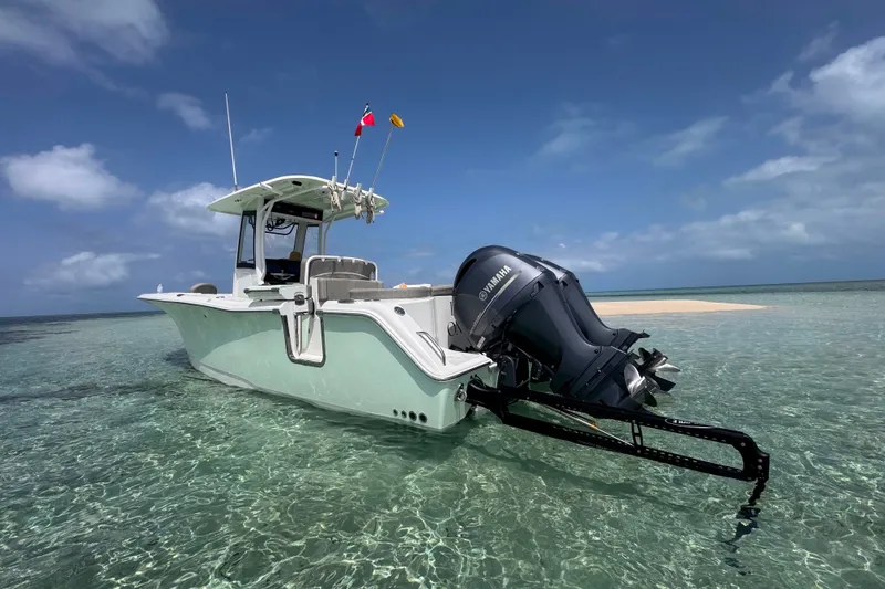 Slide: The Image of 2020 Sea Hunt Ultra 275SE boat in clear shallow water, sunny day. - 7