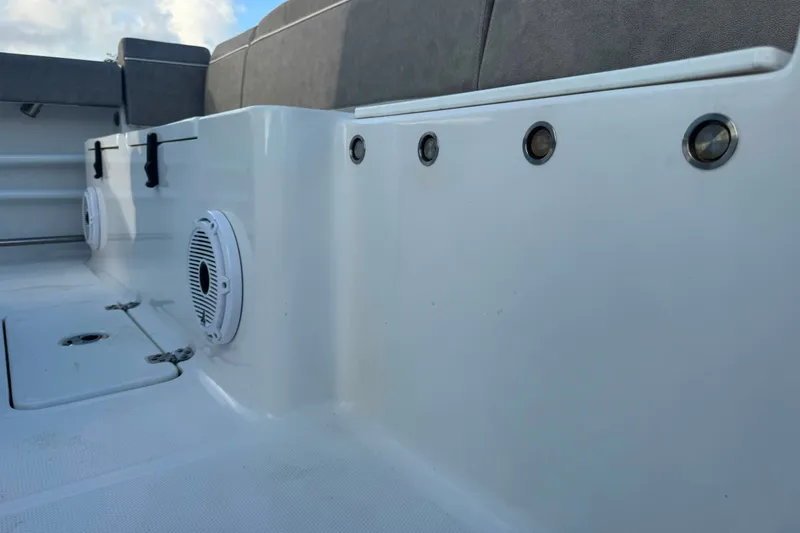 Slide: The Image of Interior view of 2020 Sea Hunt Ultra 275SE boat, featuring seating and speakers. - 22