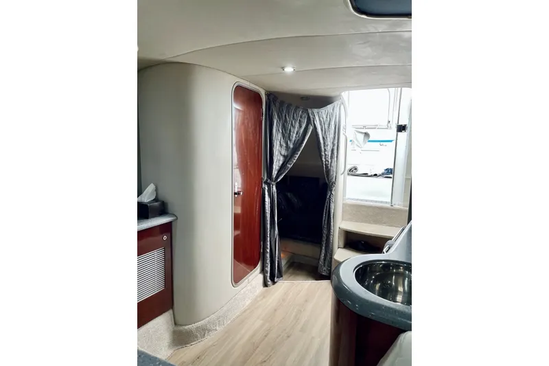 Slide: The Image of Interior of a 2006 Formula 400 Super Sport boat with elegant wood finishes. - 24