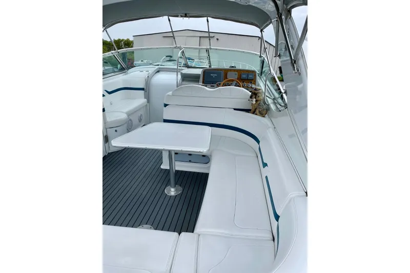 Slide: The Image of 2006 Formula 400 Super Sport boat interior with white seating and helm. - 11