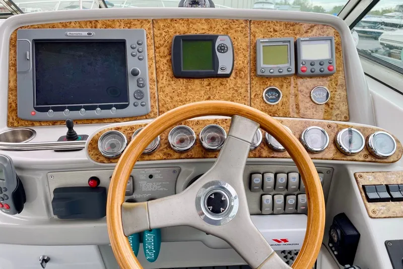 Slide: The Image of Dashboard of a 2006 Formula 400 Super Sport boat with navigation instruments. - 16
