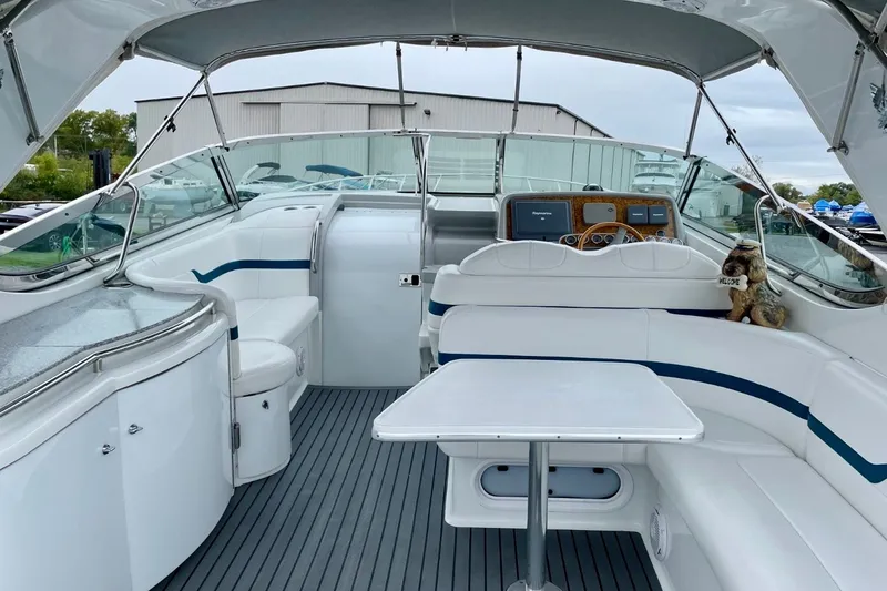 Slide: The Image of 2006 Formula 400 Super Sport boat interior with white seating and modern dashboard. - 9
