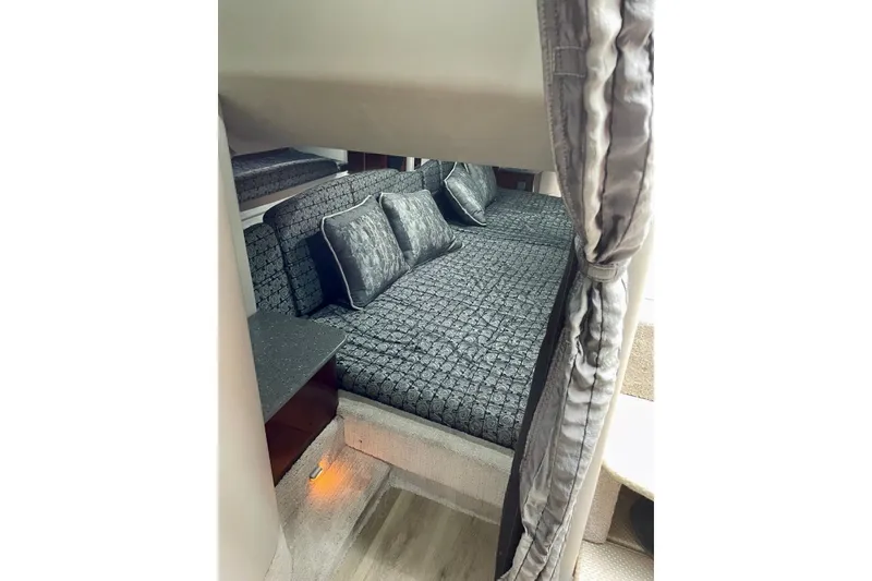 Slide: The Image of Interior cabin of 2006 Formula 400 Super Sport with elegant bedding and ambient lighting. - 27
