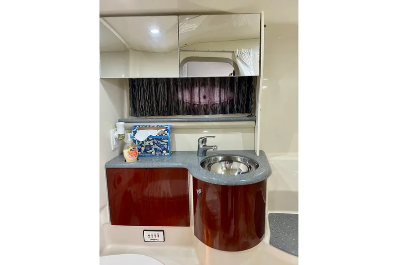 Slide: The Image of 2006 Formula 400 Super Sport yacht bathroom with sink and mirrored cabinet. - 32