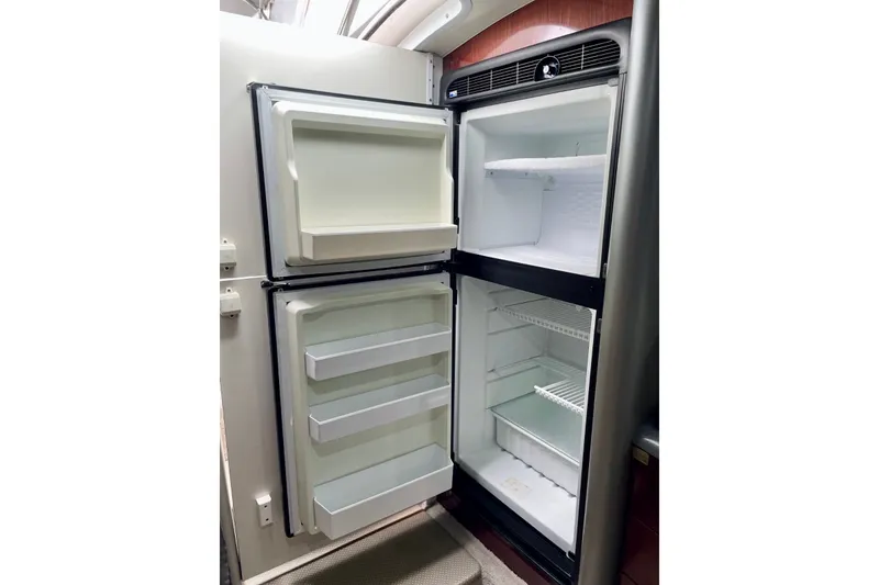 Slide: The Image of Open refrigerator in 2006 Formula 400 Super Sport boat interior. - 31
