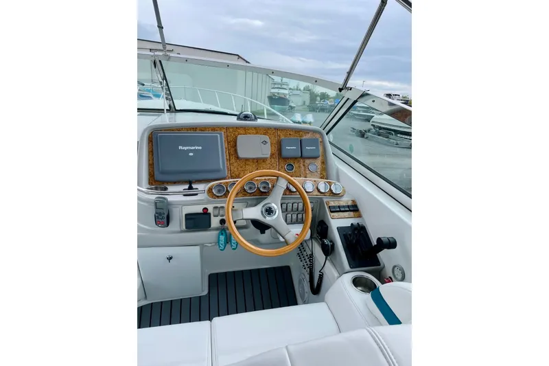 Slide: The Image of Cockpit of 2006 Formula 400 Super Sport boat with steering wheel and navigation equipment. - 14