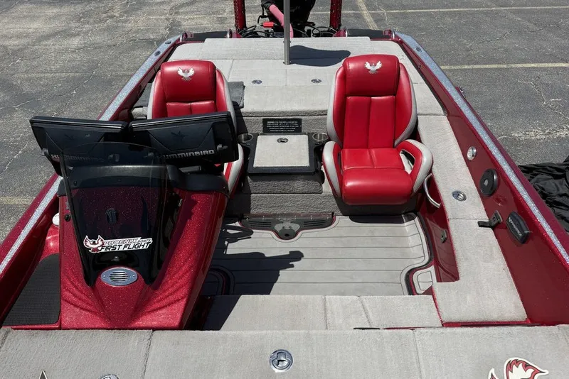 Slide: The Image of Red and gray interior of 2022 Phoenix 921 Elite boat with dual seats and control panel. - 21