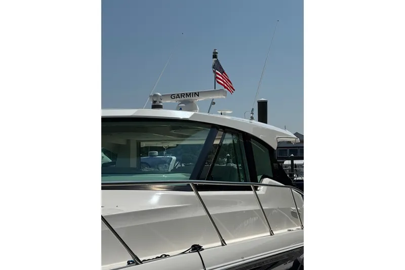 Slide: The Image of 2023 Tiara Yachts 43 LE with Garmin radar and American flag. - 26