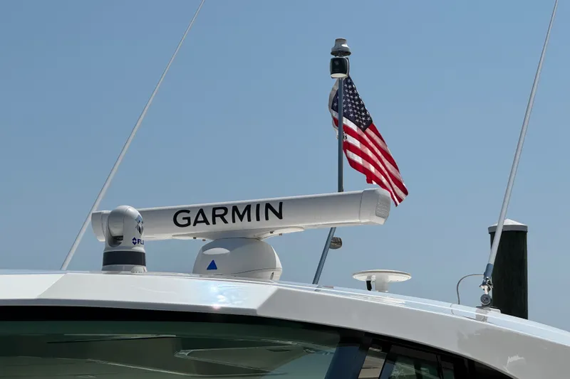 Slide: The Image of Tiara Yachts 43 LE 2023 with Garmin radar and American flag on deck. - 27