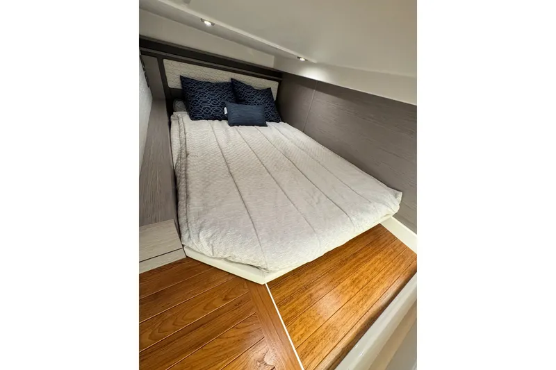 Slide: The Image of Luxurious cabin interior of 2023 Tiara Yachts 43 LE with cozy bedding. - 54