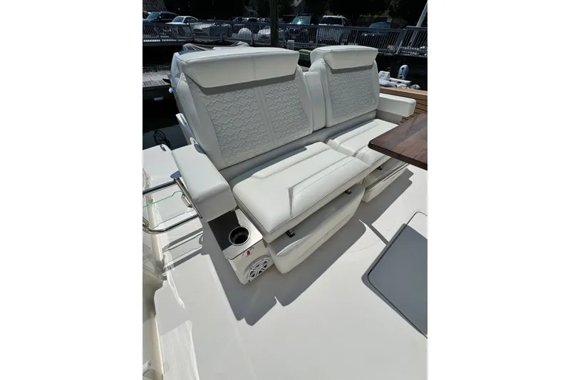 Slide: The Image of Luxurious seating on 2023 Tiara Yachts 43 LE, featuring elegant white upholstery. - 33