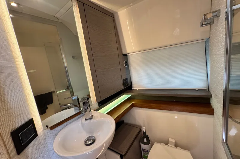 Slide: The Image of Modern bathroom interior of 2023 Tiara Yachts 43 LE, featuring sleek sink and cabinetry. - 41