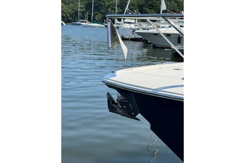 Slide: The Image of 2023 Tiara Yachts 43 LE docked in a serene marina setting. - 25