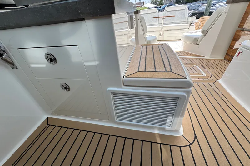 Slide: The Image of 2023 Tiara Yachts 43 LE interior with sleek cabinetry and teak flooring. - 37