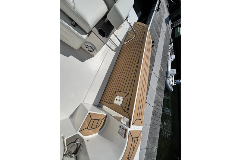 Slide: The Image of 2023 Tiara Yachts 43 LE boat deck with teak flooring and seating area. - 30