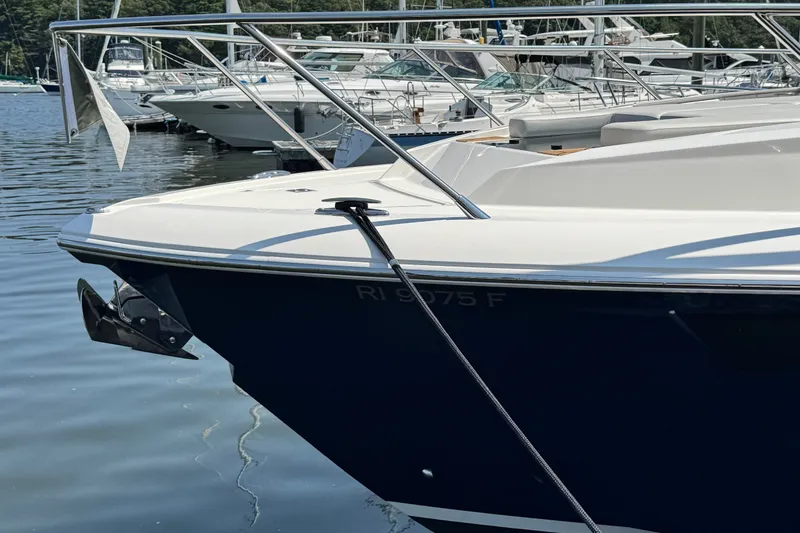 Slide: The Image of 2023 Tiara Yachts 43 LE docked in a marina, showcasing sleek design and craftsmanship. - 24
