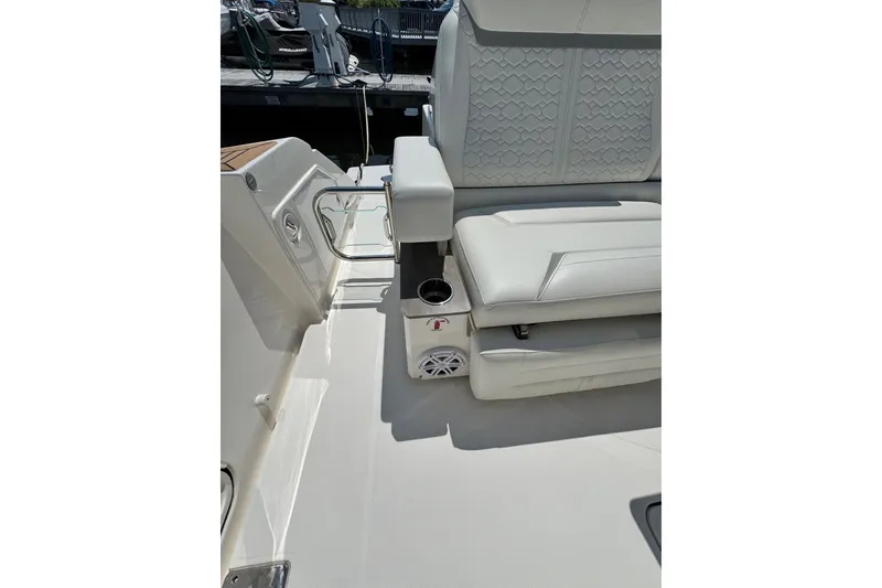 Slide: The Image of 2023 Tiara Yachts 43 LE interior with white seating and cup holder. - 34