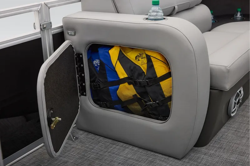 Slide: The Image of Manufacturer Provided Image: Storage compartment with life jackets on a 2026 Sun Tracker SportFish 22 XP3 boat. - 31
