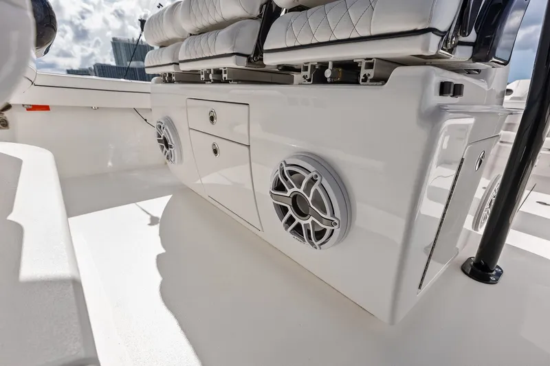 Slide: The Image of 2022 Valhalla V-41 boat interior with speakers and cushioned seating. - 53