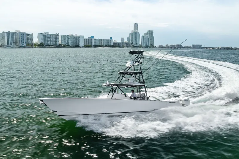 Slide: The Image of 2022 Valhalla V-41 boat cruising near city skyline on open water. - 19