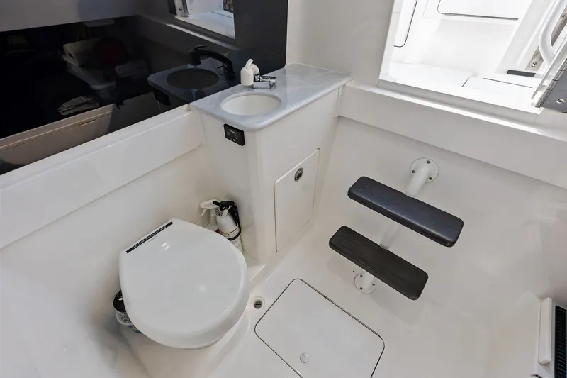 Slide: The Image of 2022 Valhalla V-41 boat bathroom with toilet, sink, and compact design. - 68