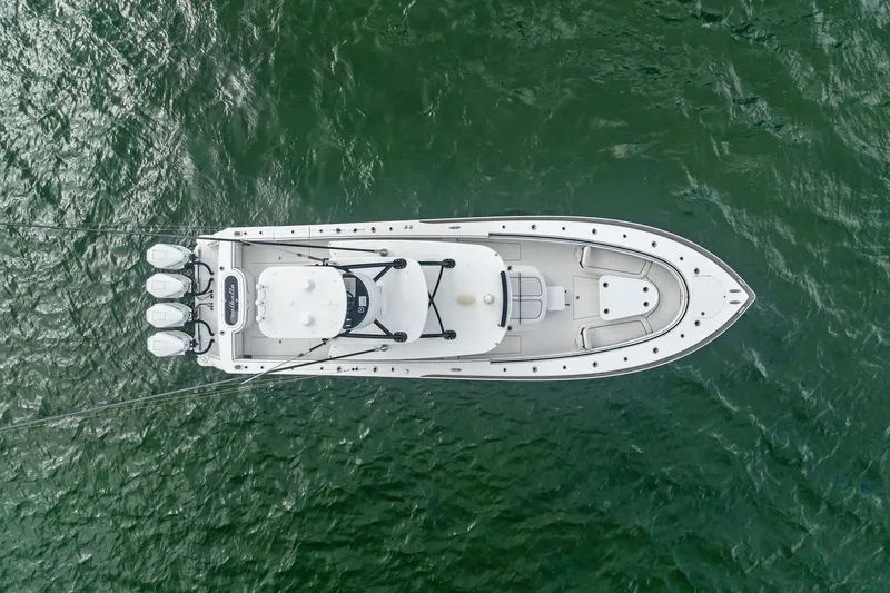 Slide: The Image of Aerial view of 2022 Valhalla V-41 boat on green water. - 12