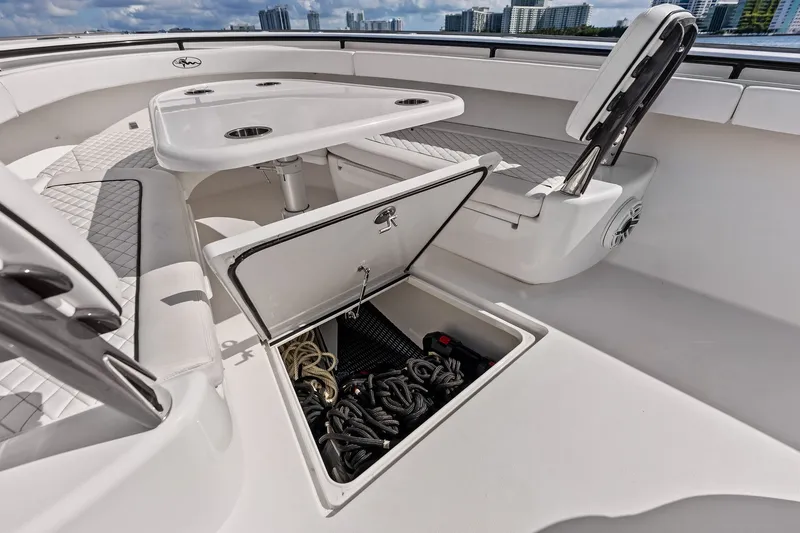 Slide: The Image of 2022 Valhalla V-41 boat interior with open storage compartment and seating area. - 36