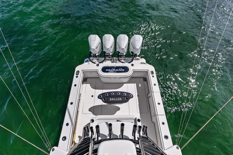 Slide: The Image of 2022 Valhalla V-41 boat with four engines on green water. - 72