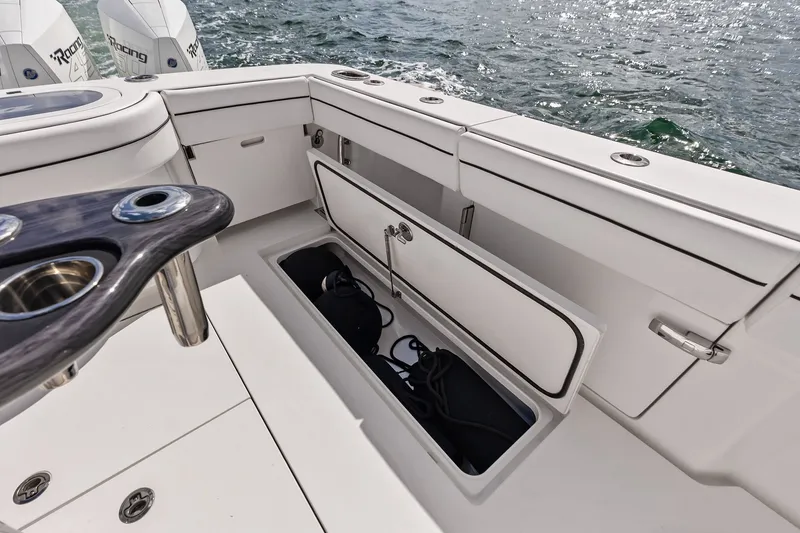 Slide: The Image of 2022 Valhalla V-41 boat deck with open storage compartment and ocean view. - 38