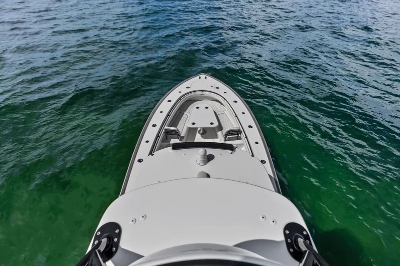 Slide: The Image of Aerial view of 2022 Valhalla V-41 boat on clear green water. - 66