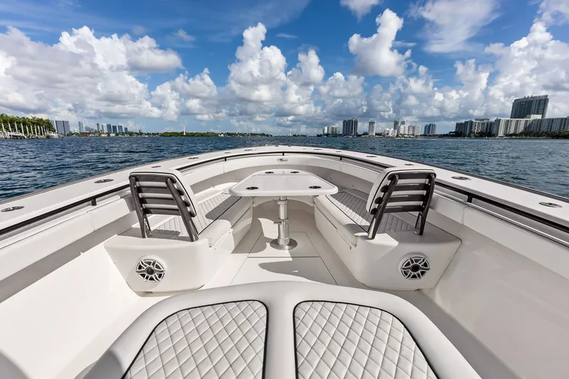 Slide: The Image of 2022 Valhalla V-41 boat interior with seating and table, ocean view, blue sky. - 61