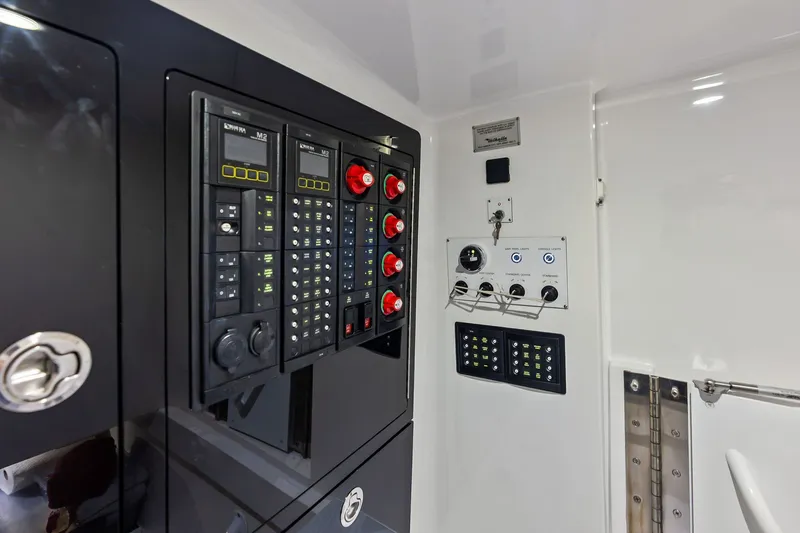 Slide: The Image of Control panel of 2022 Valhalla V-41 boat, featuring switches and gauges. - 71