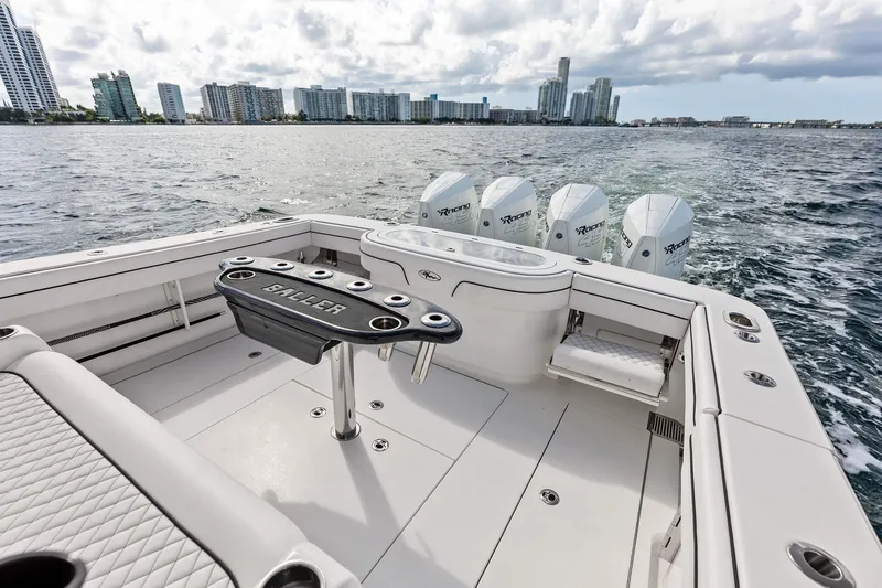 Slide: The Image of 2022 Valhalla V-41 boat with powerful engines, cruising near city skyline. - 28