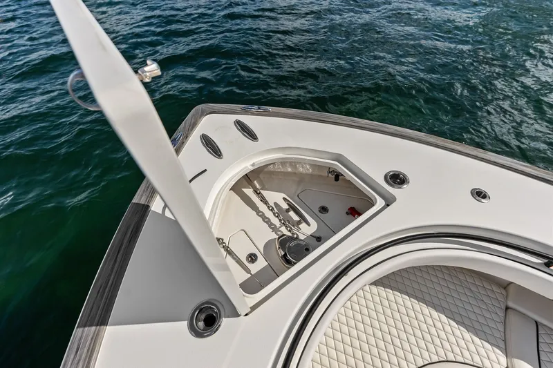 Slide: The Image of Valhalla V-41 2022 boat anchor compartment with open hatch, on calm water. - 65