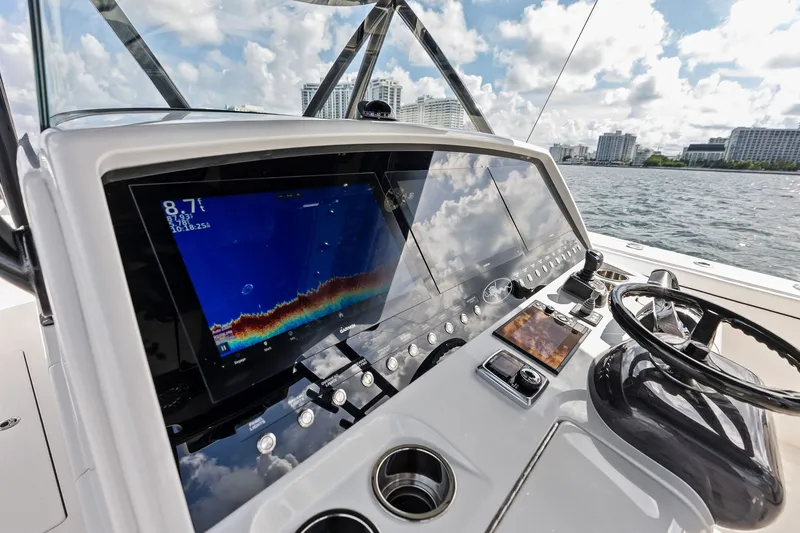 Slide: The Image of 2022 Valhalla V-41 boat dashboard with advanced navigation system on open water. - 45