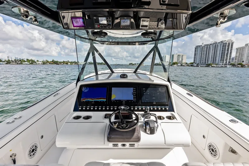 Slide: The Image of 2022 Valhalla V-41 boat cockpit with advanced navigation system on open water. - 41