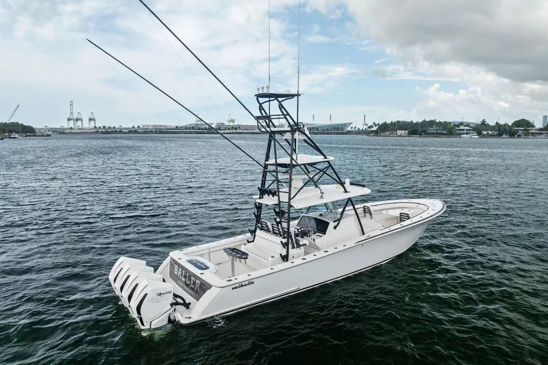 Slide: The Image of 2022 Valhalla V-41 boat on water with fishing tower and outboard engines. - 7