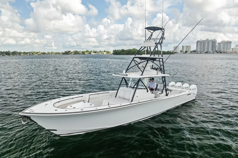 Slide: The Image of 2022 Valhalla V-41 boat on calm water with city skyline in background. - 4