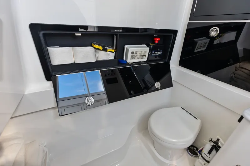 Slide: The Image of 2022 Valhalla V-41 boat bathroom with storage compartment and toilet. - 69