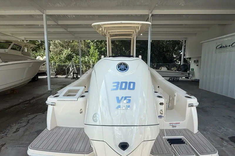 Slide: The Image of 2027 Scout 240 XSF boat with 300 V6 4.2L engine in covered storage. - 16