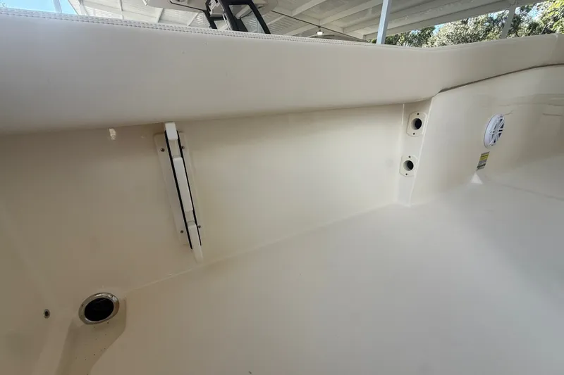 Slide: The Image of Interior view of a 2027 Scout 240 XSF boat, showcasing seating and speaker details. - 18