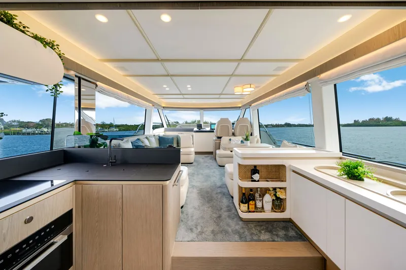 Slide: The Image of Interior of a luxurious 2024 Azimut Magellano yacht with modern kitchen and panoramic windows. - 22