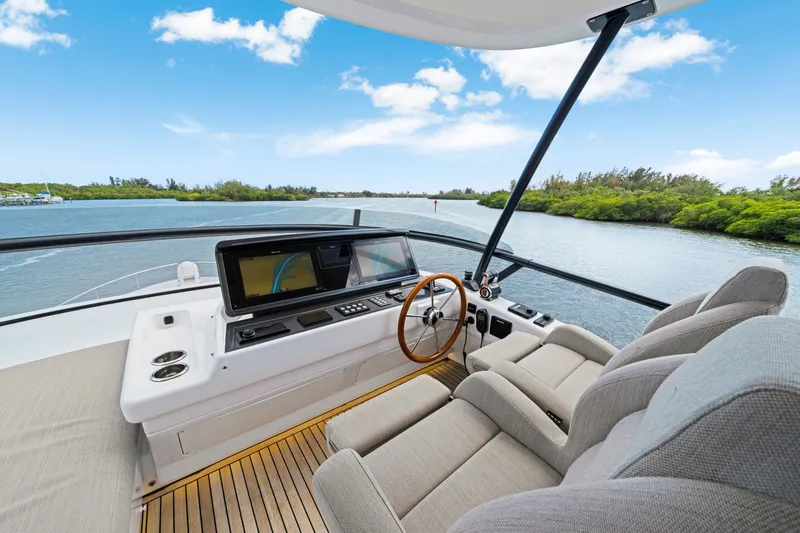 Slide: The Image of The image shows the helm of a 2024 Azimut Magellano with modern navigation systems. - 46