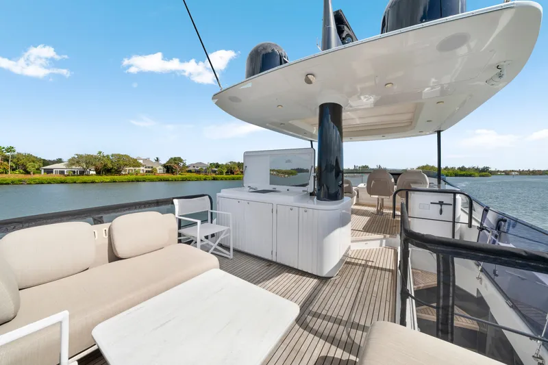Slide: The Image of The image shows the deck of a 2024 Azimut Magellano with elegant seating and modern design. - 49
